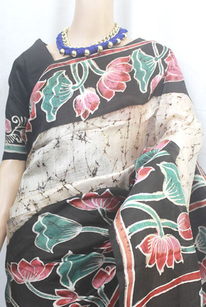 Off-white color-based body with crack batik and lotus with leaves motif hand-painting  border and pallu of the  saree makes you beautiful, attractive and they have a fantastic fall.