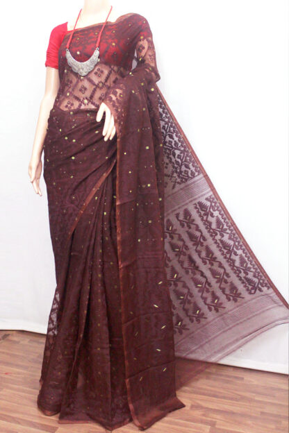 The Chocolate brown-based self-jamdani work soft dhakai saree looks elegant, comfortable, and classy.