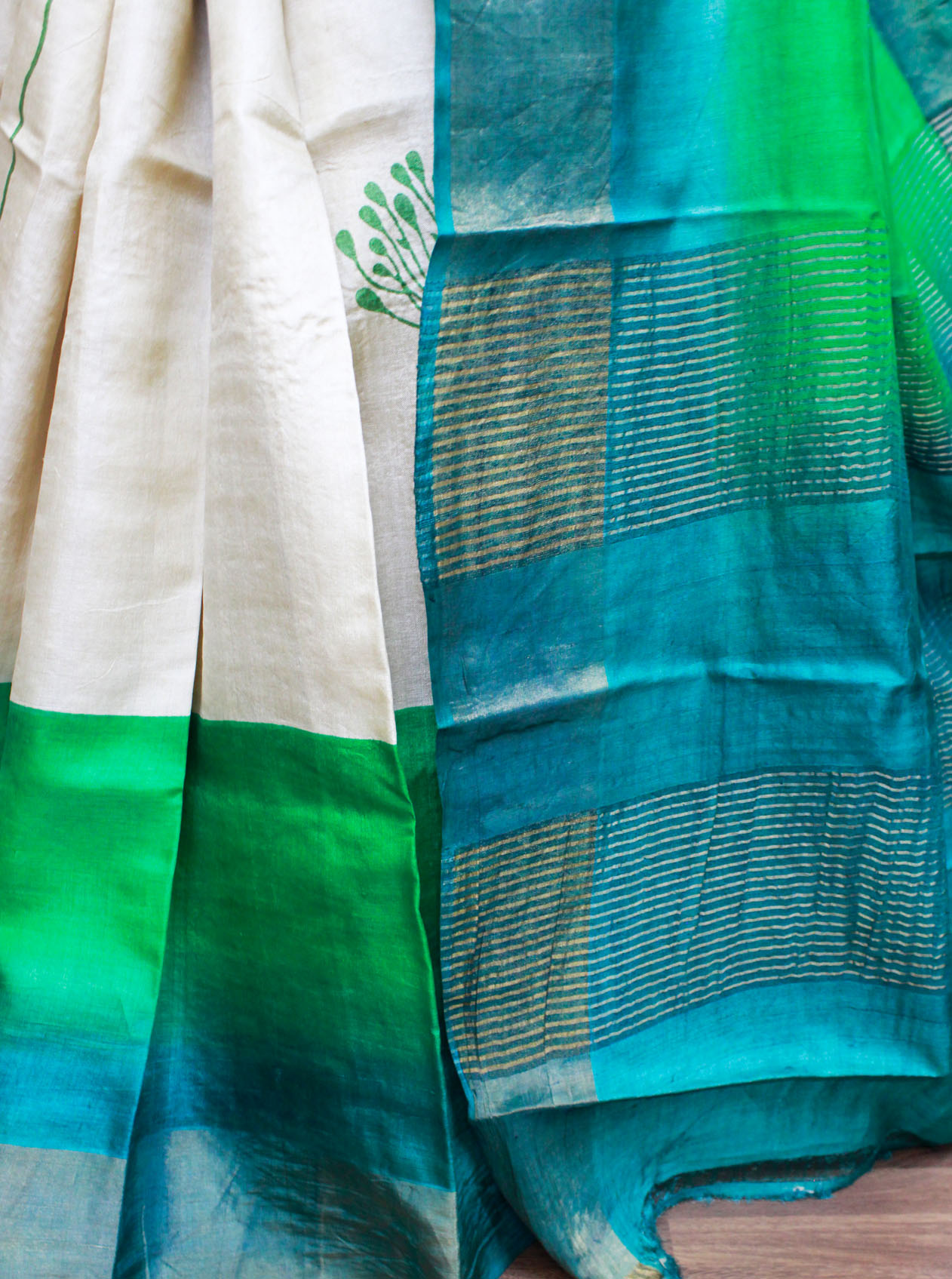 natural beige color-based with green block printed body with zari border, pallu and blouse piece, floral printed zari border tussar silk saree